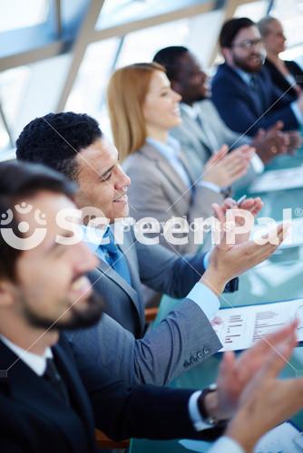 Young Professionals Applauding Reporter After Seminar Presentation